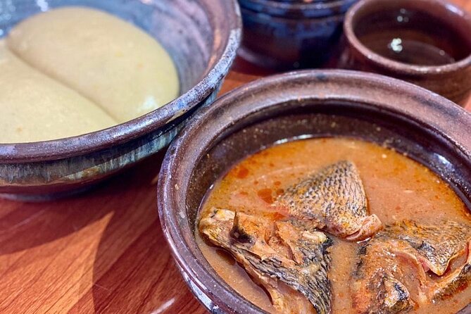 Local Ghanaian Food Tasting Tours - Sampling Ghanaian dishes at the table
